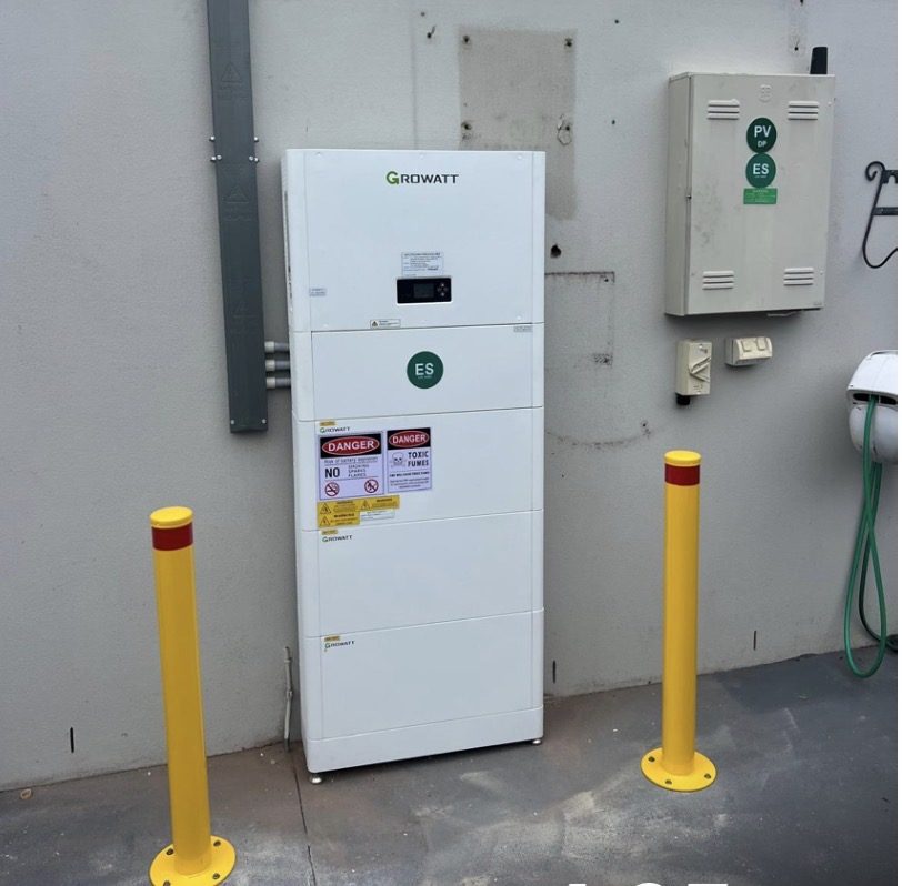 Growatt solar inverter and battery storage unit mounted on a wall